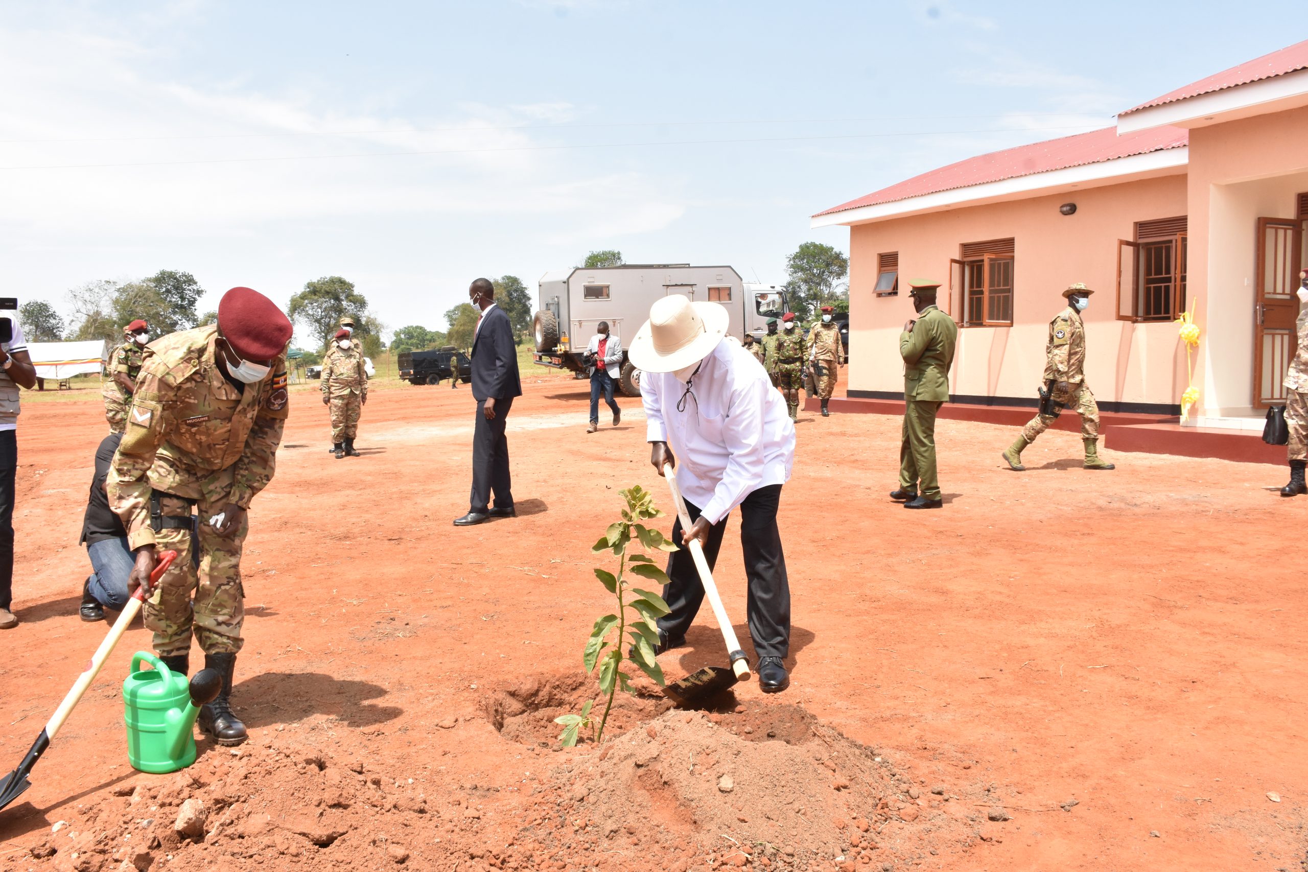 HE-the-President-Gen-Yoweri-K-Museveni-planting-a-tree-at-the-commissioned-housing-units-at-Lunyo-barracks-on-23-July-2022-scaled